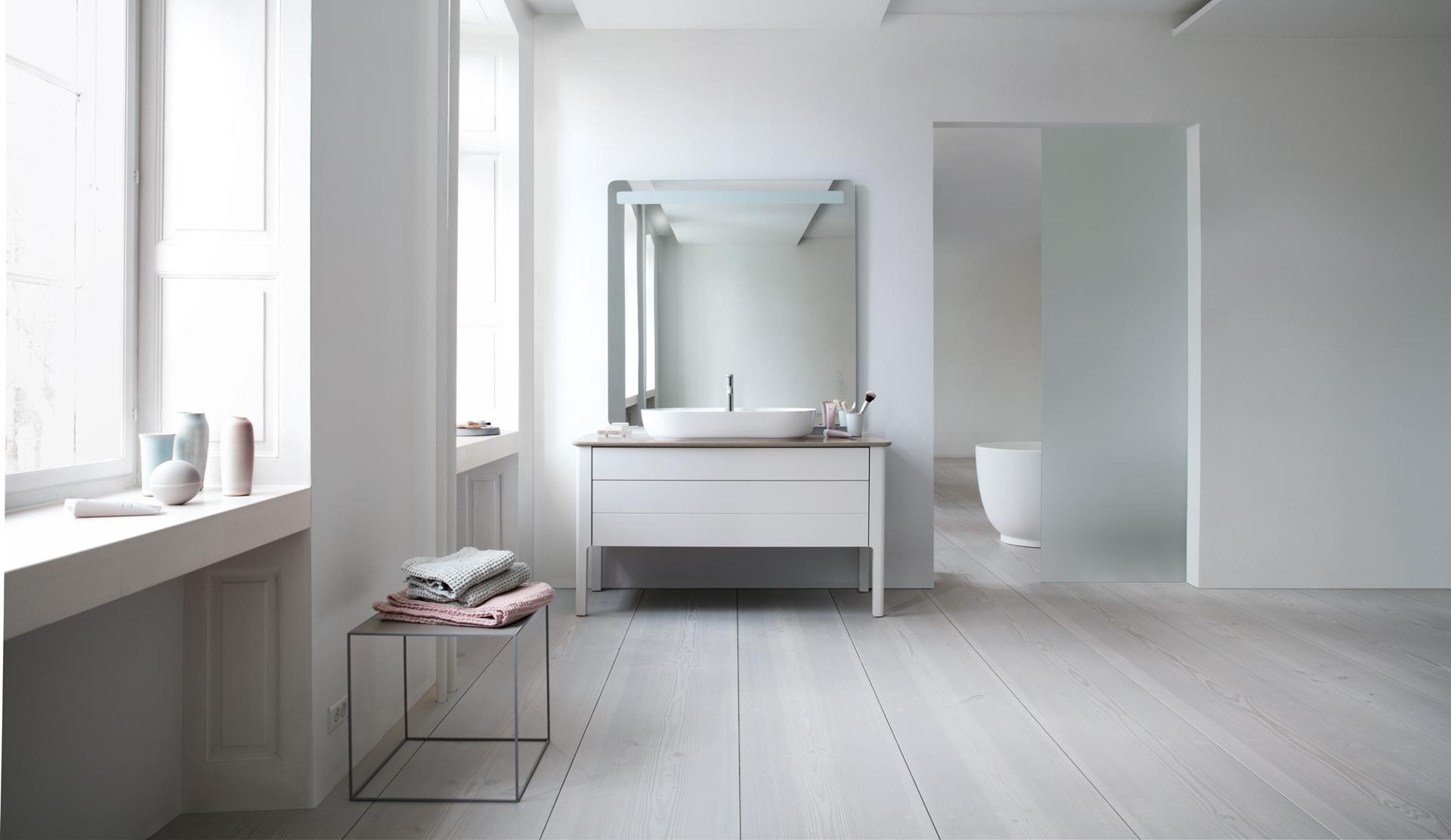 Large bathroom with countertop sink and mirror
